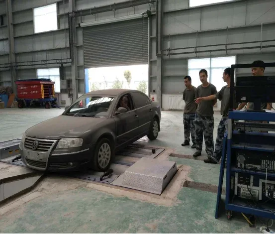 Military personnel inspecting a vehicle on the field inspection line.